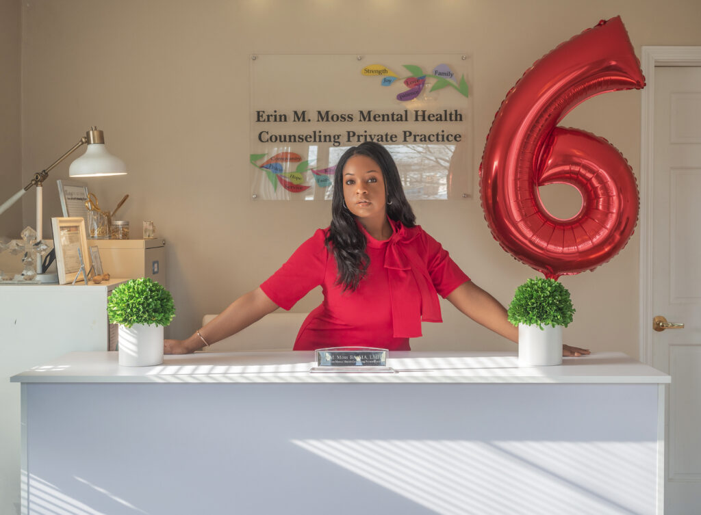 Erin standing behind private practice front desk